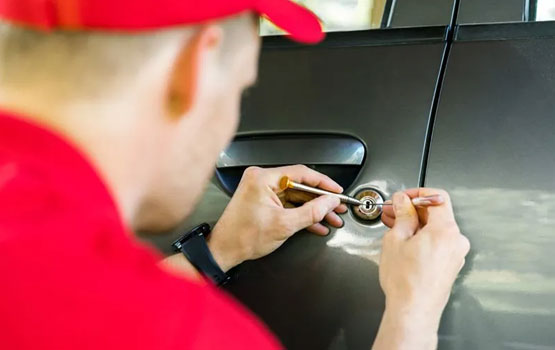Locksmith performing an emergency car lockout service in Brownwood TX